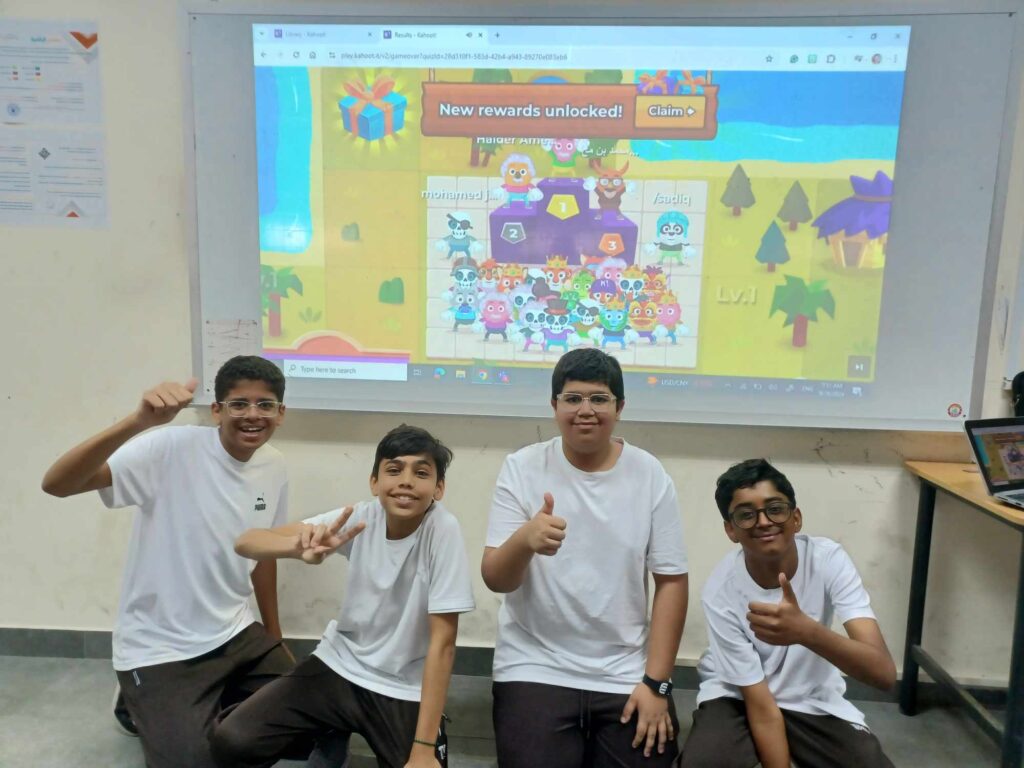 Winning children posing in front of Kahoot! podium 