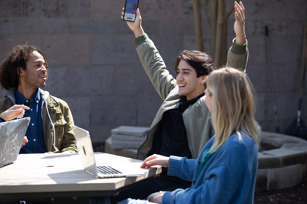 Three students playing a kahoot